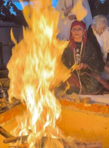 Yogini Shambhavi at a ceremony Infront of a fire 