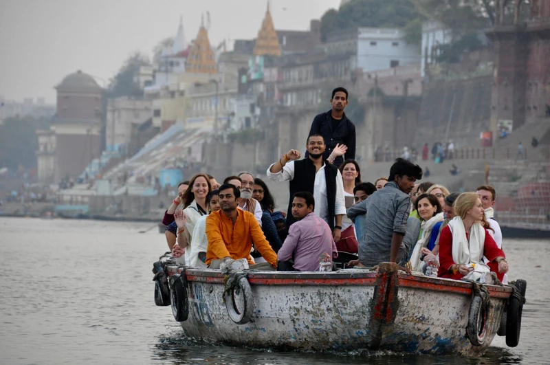 Students riding a boat during a yoga retreat in India